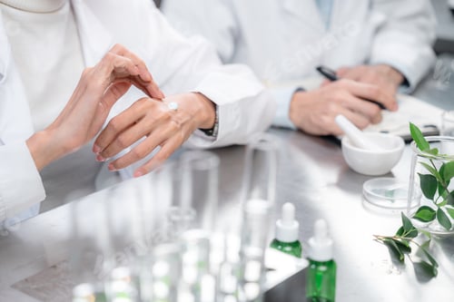 Preview: Beauty eco cosmetic research and development concept, Pharmacist applying moisturizer lotion