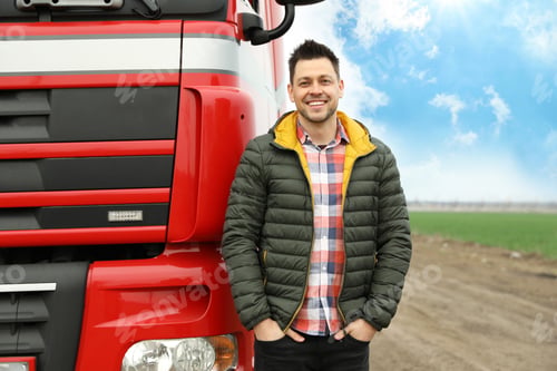 Preview: Portrait of happy driver at modern truck outdoors. Space for text