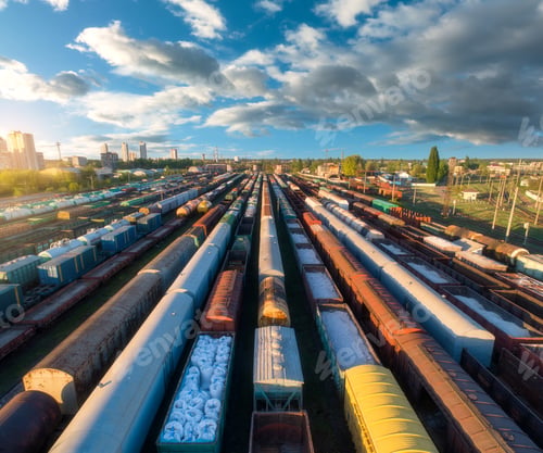 Preview: Drone view of freight trains at sunset. Railway cargo wagons
