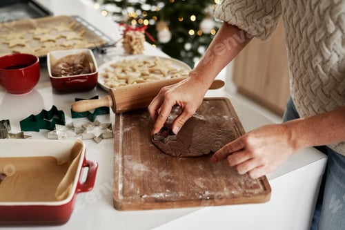 Preview: Unrecognizable woman preparing dough for gingerbread cookies