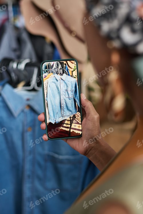 Preview: Smartphone with denim shirt on screen