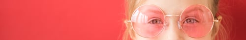 Preview: Site header. Little girl in pink glasses on red background