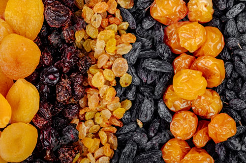 Preview: top view of assortment of dried fruits apricots raisins cherries and cherry plums