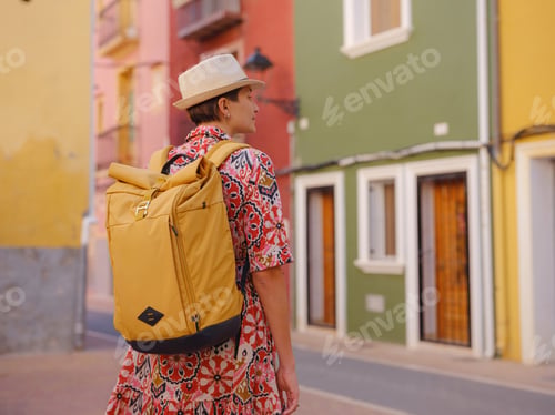 Preview: Woman strolls through colorful streets of Spanish coastal town