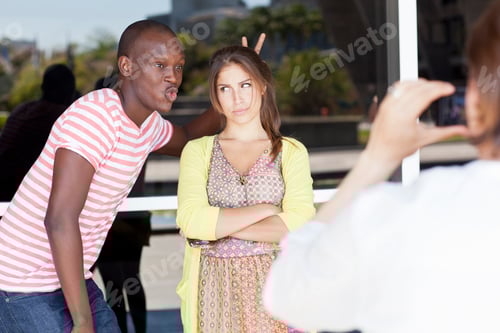 Preview: Student photographer taking picture of friends