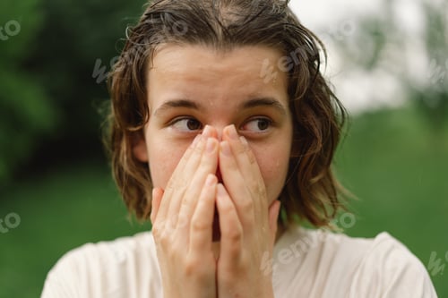 Preview: Cheerful Teen Girl With Pronounced Face From Sprayed Small Splashes Warm Summer Rain In Outdoors.