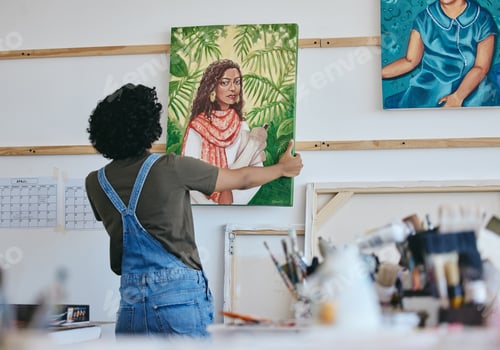 Preview: Woman artist, painter and hanging canvas on wall for exhibition to display in studio, art gallery o