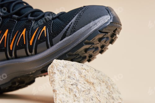 Preview: Black Hiking Boot on Small Rocks in Studio