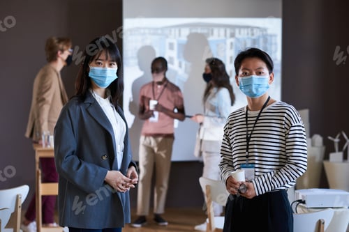 Preview: Professionals in a Meeting Wearing Protective Face Masks