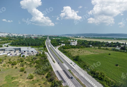 Preview: Highway among green fields aerial view