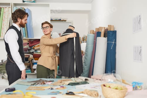 Preview: Tailor sewing suit for her client