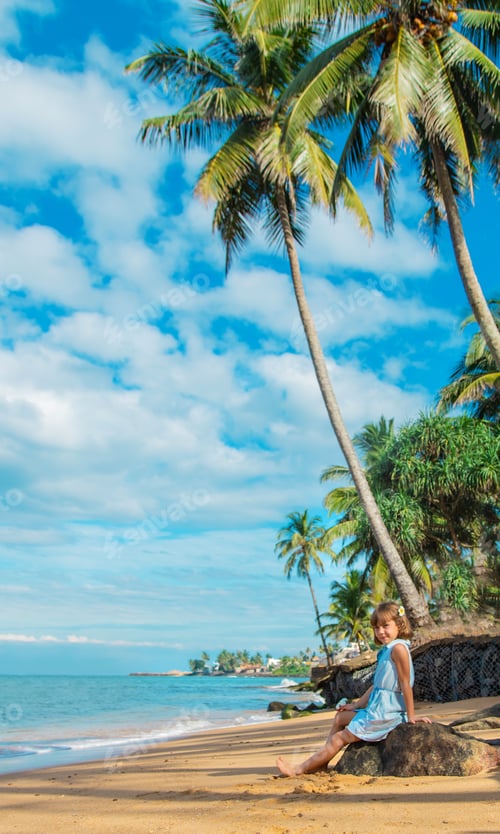 Preview: Child girl on the beach in Sri Lanka. Selective focus.