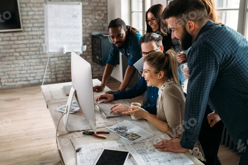 Preview: Company employees working in office