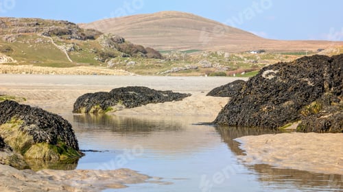 Preview: Coastal landscape scenery, sandy beach with mountains in background at Silverstrand beach