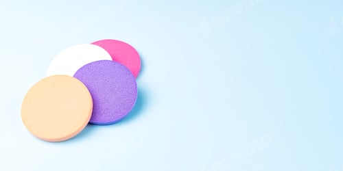 Preview: Set of Cosmetic colorful sponges on blue background, copy space, Cosmetology tools for makeup artist
