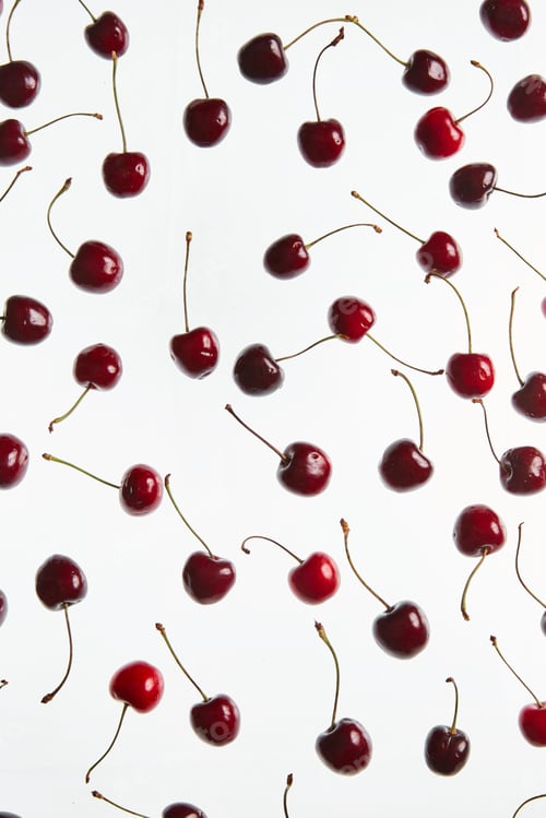 Preview: Scattered sweet cherries on white vintage background with copy space