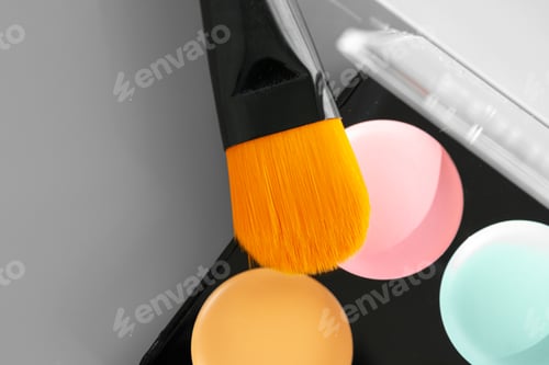 Preview: Make-up palette with colorful concealers on gray background