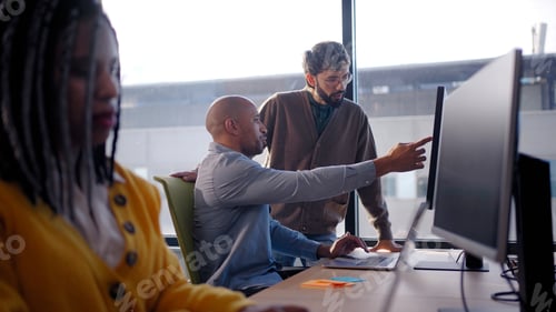 Preview: Diverse team meeting in bright corporate office