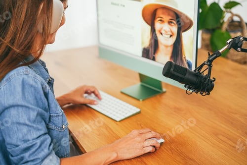 Preview: Influencer woman doing podcast using computer at home