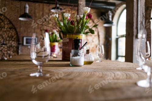 Preview: Surface level of condiments and flower vase on table in restaurant