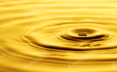 Preview: Yellow drop falling creating a splash of oil or water background. Olive, sunflower oil. Crown drop
