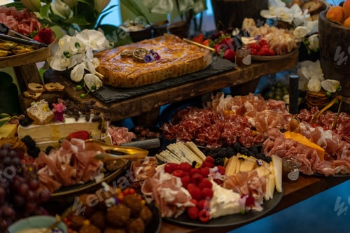 Preview: Crackers and berries on a grazing table of food at a party, grazing table of antipasto food