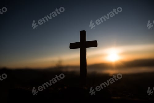 Preview: Silhouette of catholic cross and sunrise