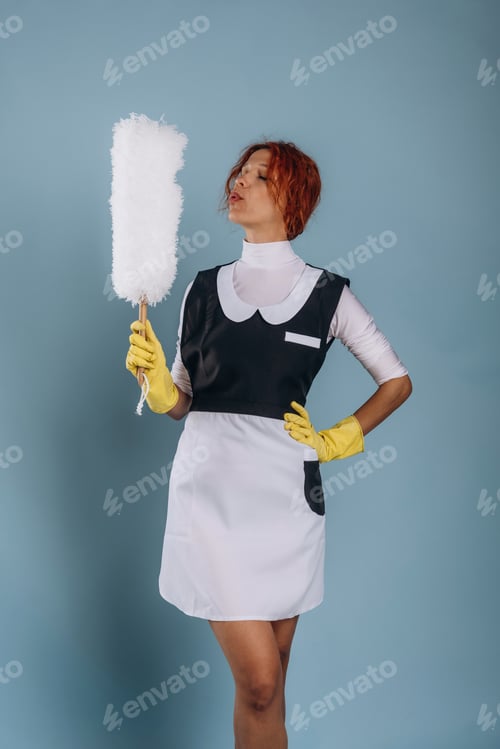 Preview: Maid is with dust brush. Woman is in the studio against background