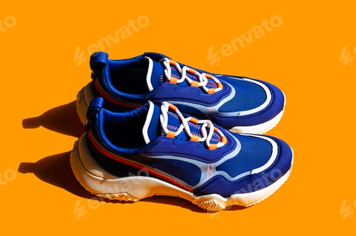 Preview: Blue Sneakers on Orange Background.