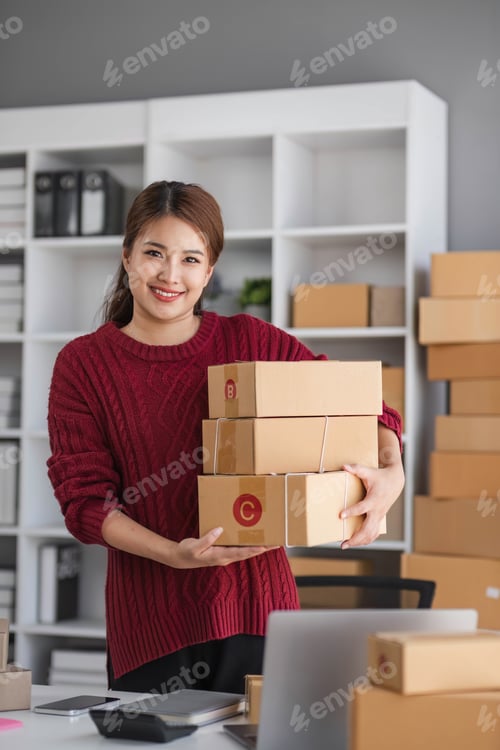 Preview: Starting small business entrepreneur of independent Asian woman smiling using computer laptop with