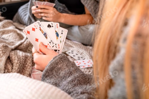 Preview: hands of people playing cards at home, selective focus, focus on cards