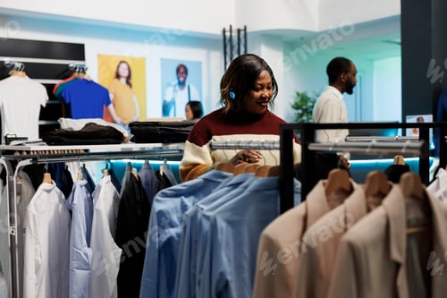 Preview: Store customer browsing apparel rack