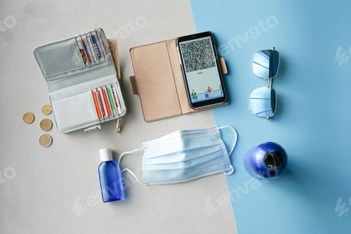 Preview: Travel items flat lay on blue and grey background