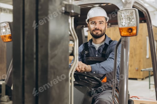 Preview: Warehouse worker driving forklift in modular building industry