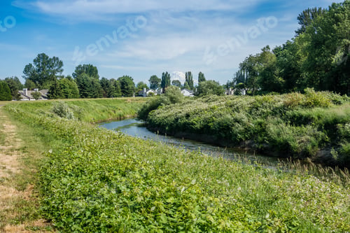 Preview: A View Of Homes Along The Green River In Kent, Washington. The Tip Of Mount Rainier Can Be Seen.