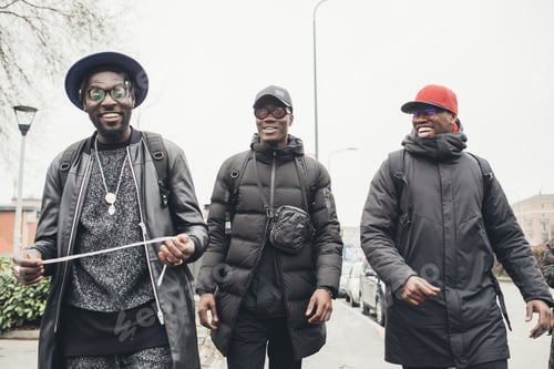 Preview: Three young african men walking in the street together