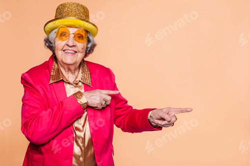 Preview: Smiling grandmother pointing two fingers to side
