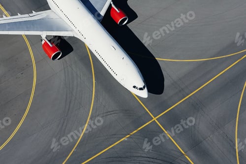Preview: Aerial view of plane at airport. Airplane taxiing to runway before take off.