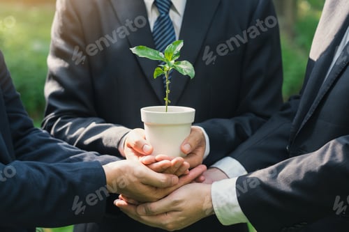 Preview: Earth Day Environmental, Business hands holding a plant pot with green plants in the ground