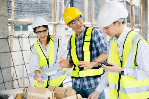 Preview: Engineer teams meeting working together wear worker helmets hardhat on construction site