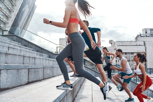 Preview: Group Of Young People In Sports Clothing Jogging While Exercising On The Stairs Outdoors