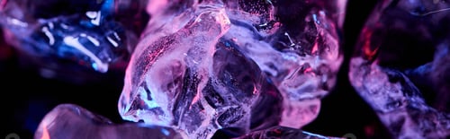 Preview: panoramic shot of transparent ice cubes with purple colorful lighting isolated on black