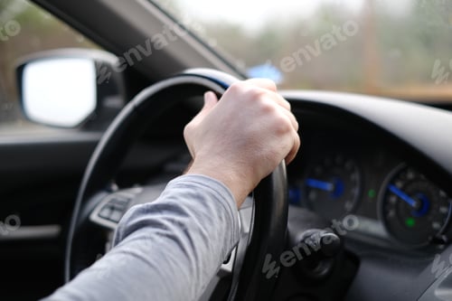 Preview: Closeup of a hand on the steering wheel