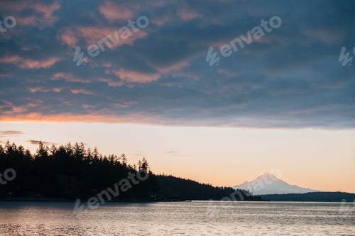 Preview: Clouds over scenic view of mountains over water, Bainbridge, Washington, United States