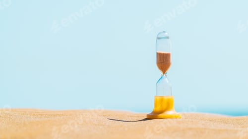 Preview: Sand running through an old hourglass measuring passing time and counting down to a deadline