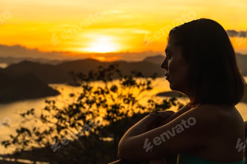 Preview: Tourist watching coron island sunset from mount tapyas viewpoint in busuanga, philippines