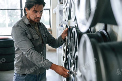 Preview: Time for replacement. Man is in the tire fitting car service