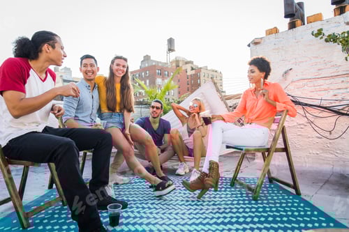 Preview: Group of friends having party on a rooftop