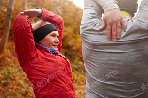 Preview: Older couple stretching their arms and hands