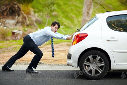 Preview: I hate having car trouble. Portrait of an unhappy man pushing his car.
